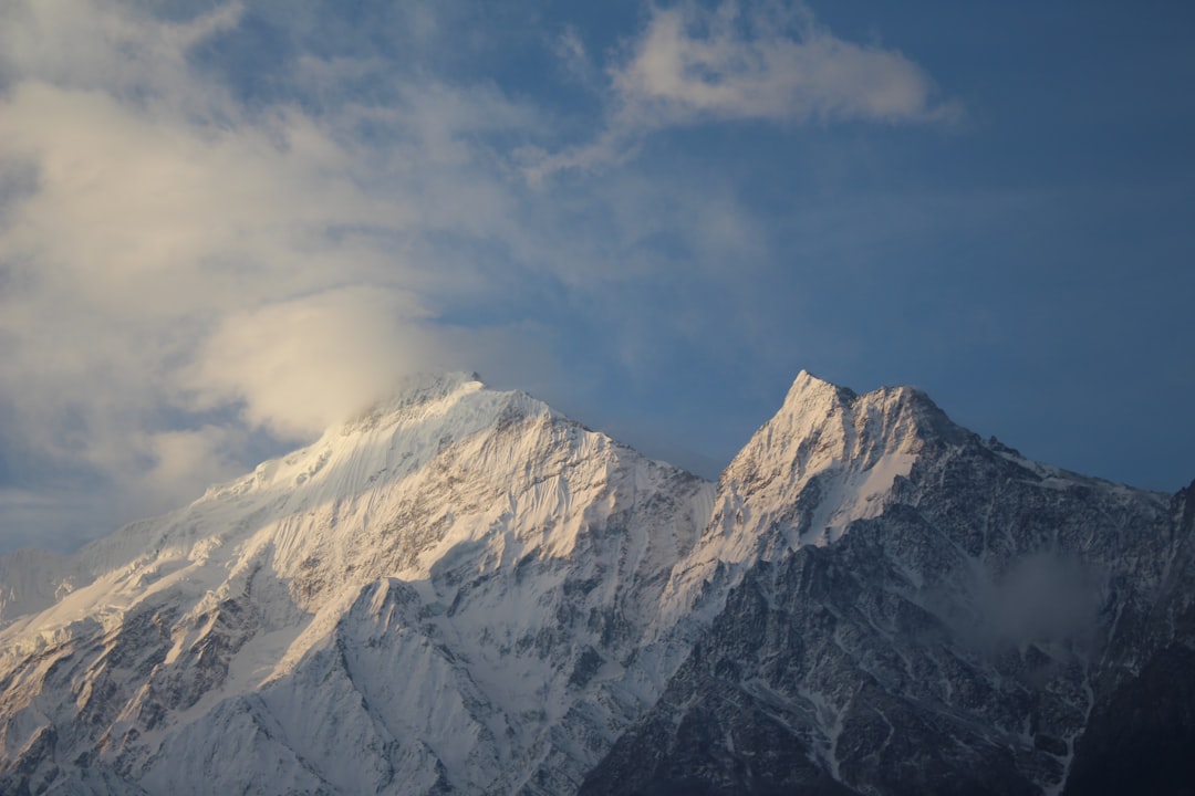 mountain coated with snow,