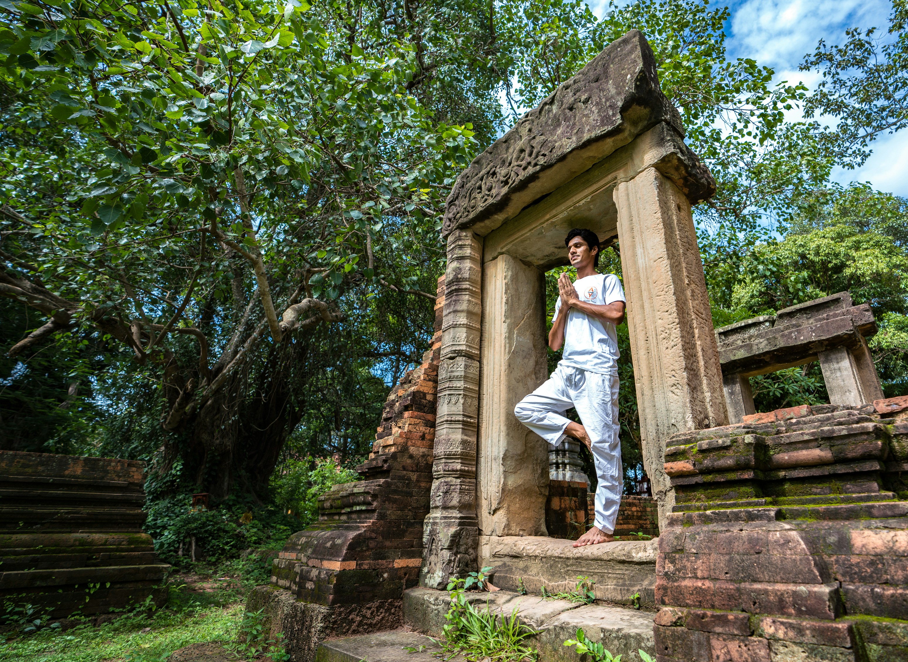man sitting in concrete gateway