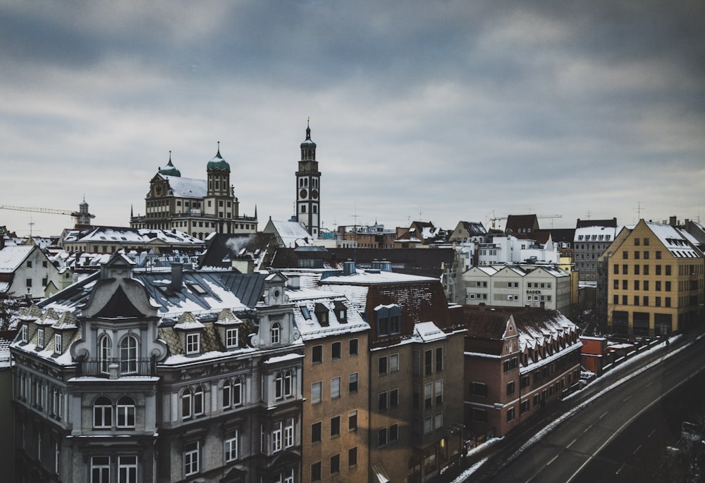 high rise buildings under clouds