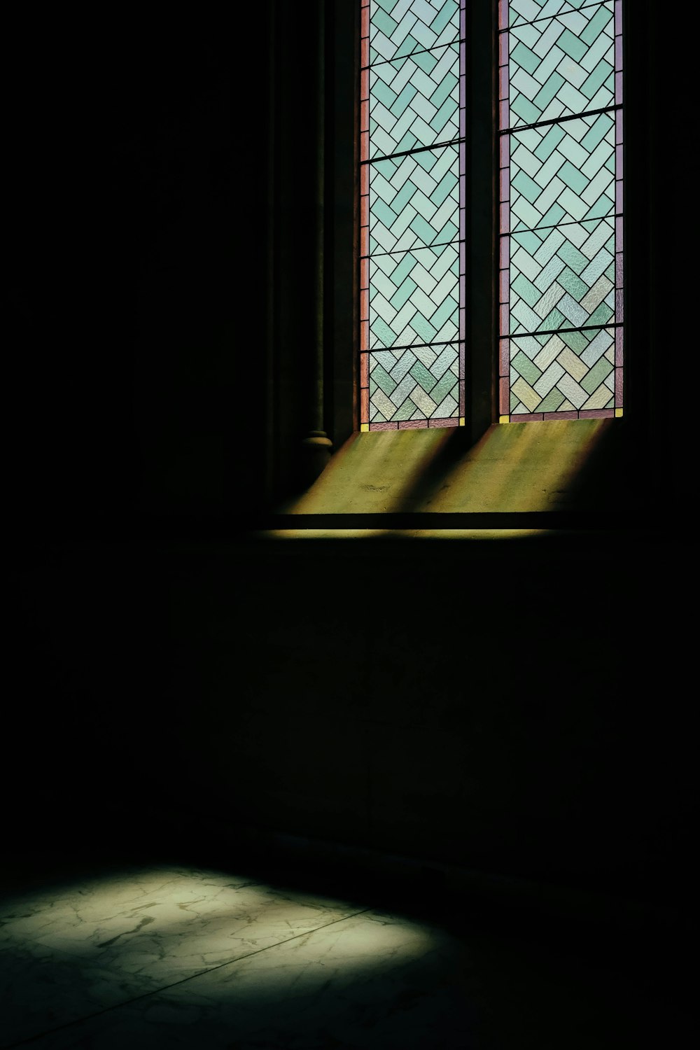 lights reflecting on gray concrete floor