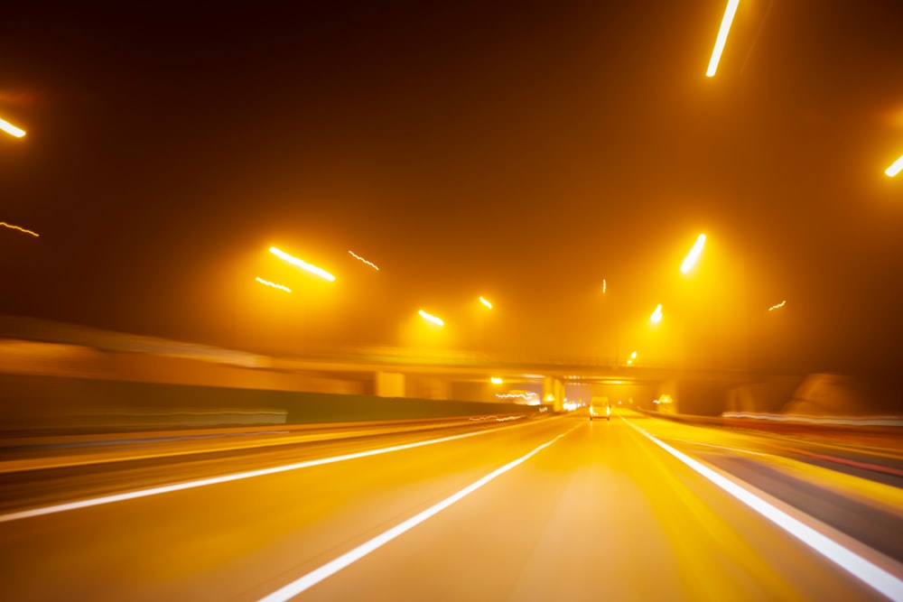 timelapse photography of vehicles on road at night