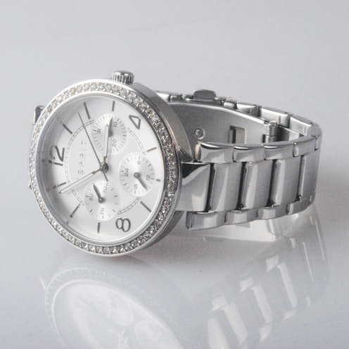 round silver-colored chronograph watch with link band displaying 2: 48