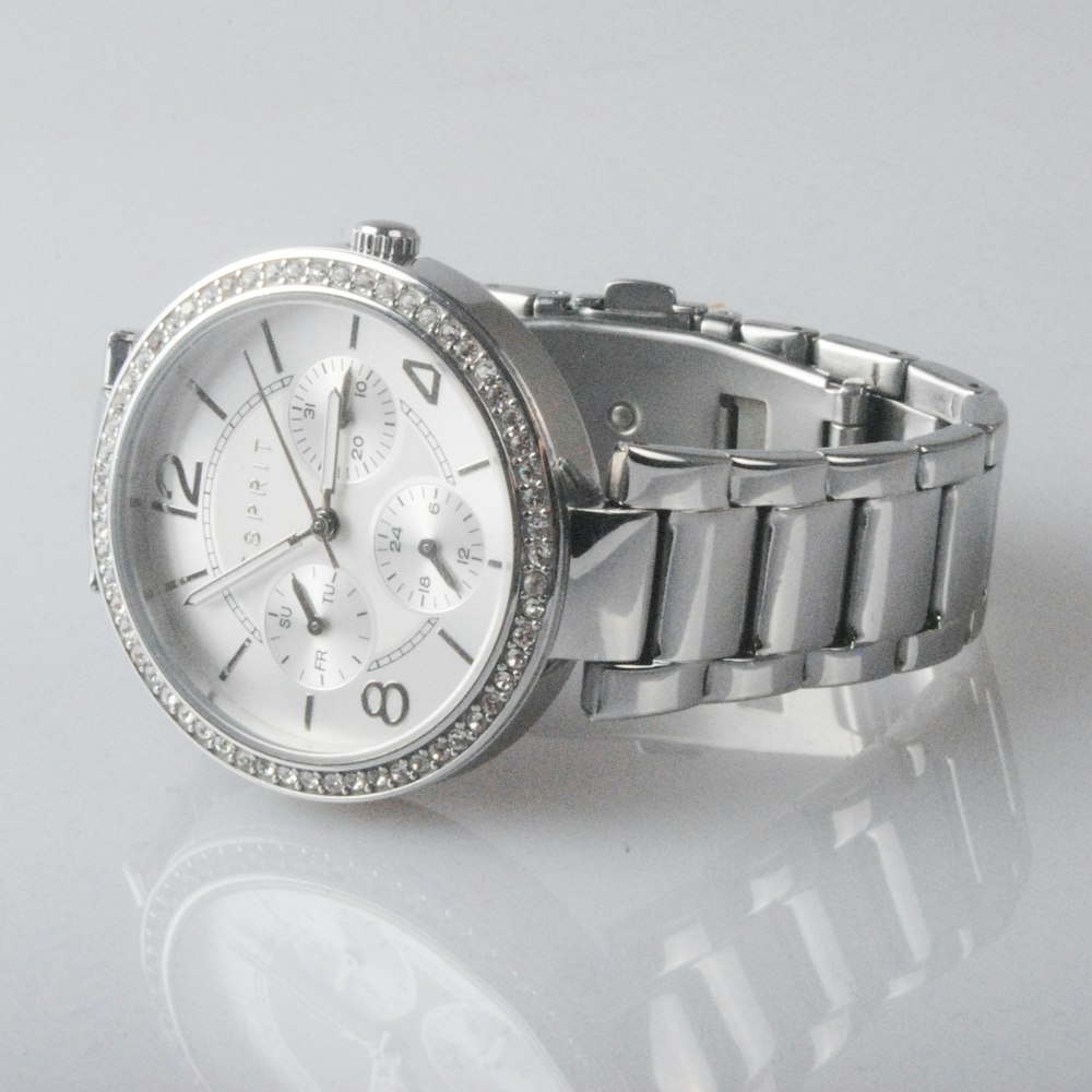 round silver-colored chronograph watch with link band displaying 2: 48