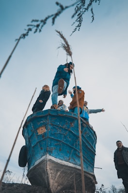 A group smiling on a boat, ready for a snorkeling excursion under sunny skies.