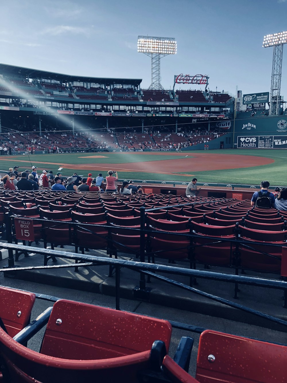 people sitting inside baseball arena during daytime