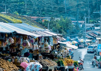 fruits on display beside road during daytime