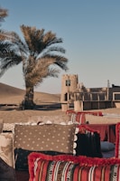 A terrace overlooking a serene desert sunset with cozy outdoor seating