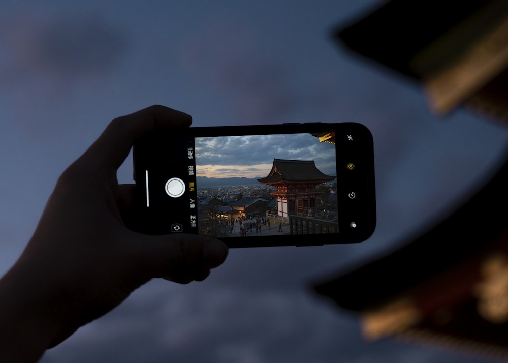 phone displaying brown pagoda