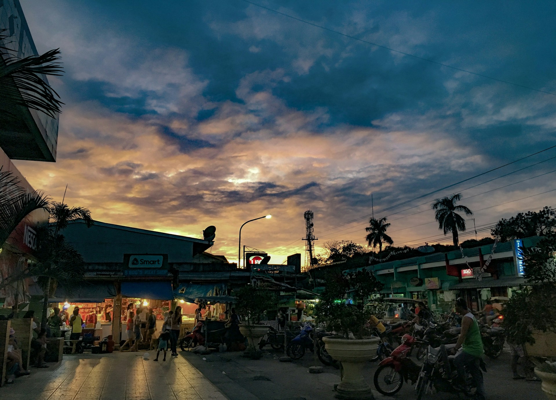 A vibrant street scene bursting with color and life during golden hour.