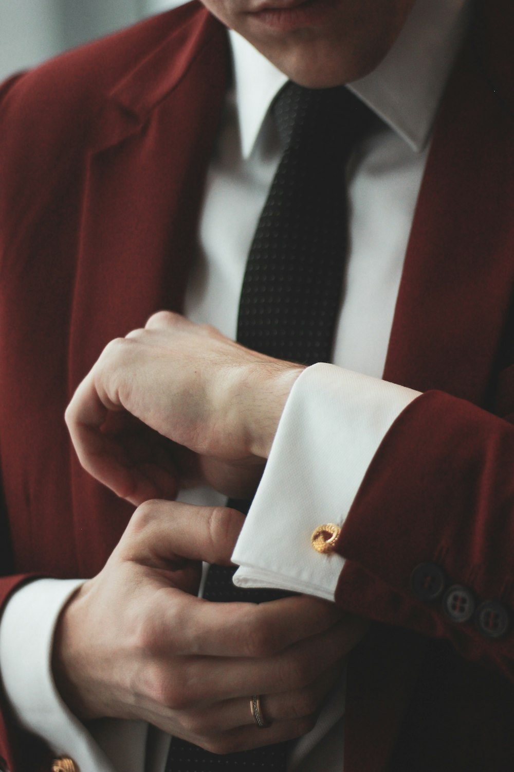 man wearing maroon and white dress suit