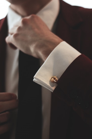 man wearing maroon and white dress suit