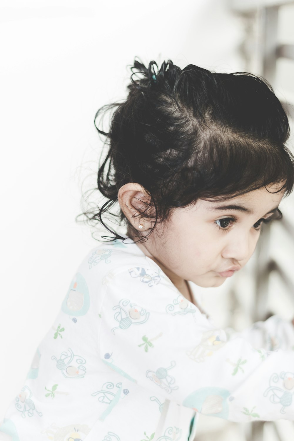 close-up photography of woman looking outside by window