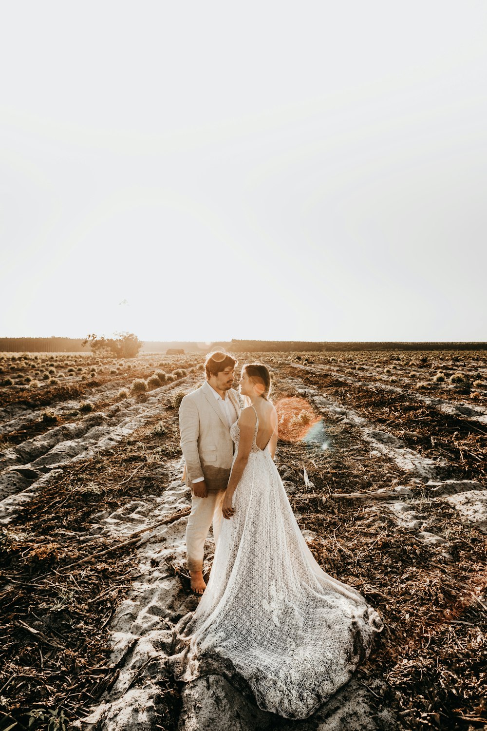 man and woman under white sky