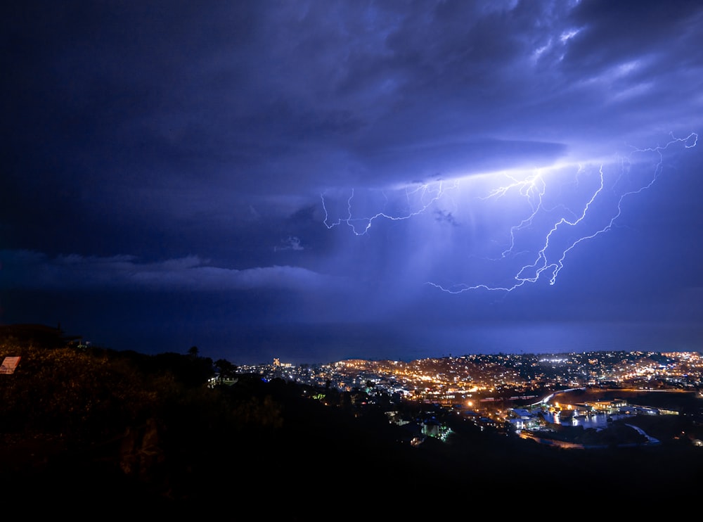 aerial view photography of city skyline under lightnings