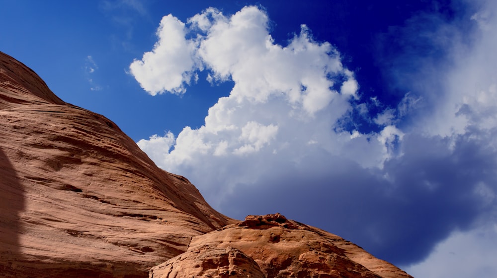 brown mountain under white sky