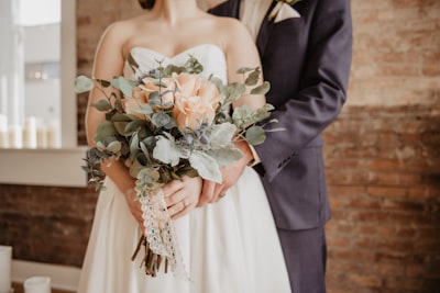 woman holding beige-petaled flower bouquet wedding google meet background