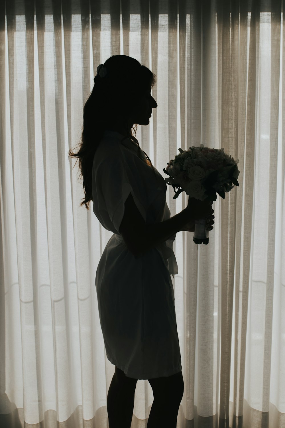 woman holding white bouquet