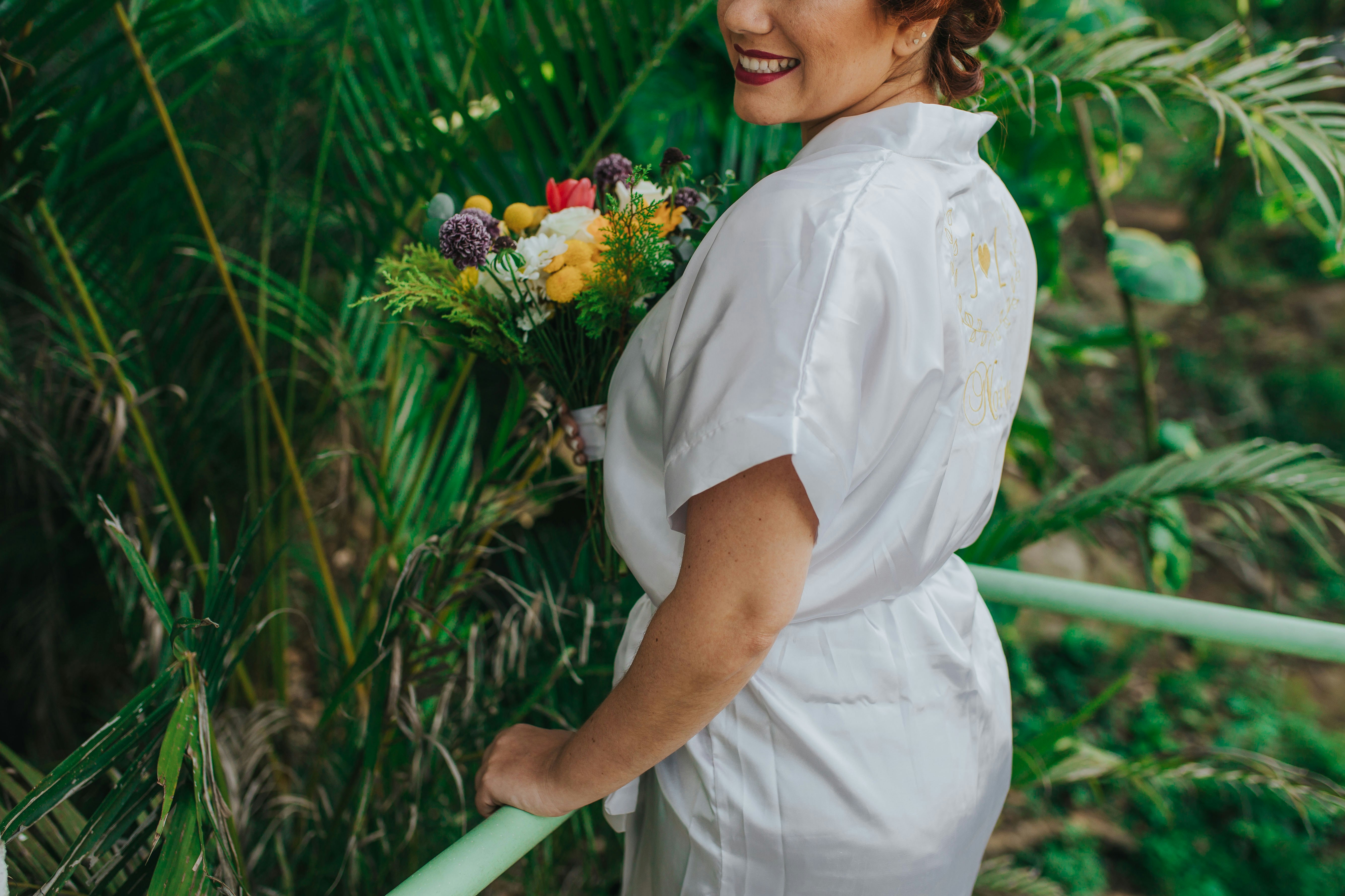 smiling woman holding flowers bouquet