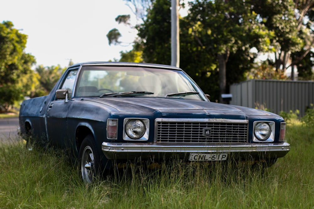 gray coupe parked near tree