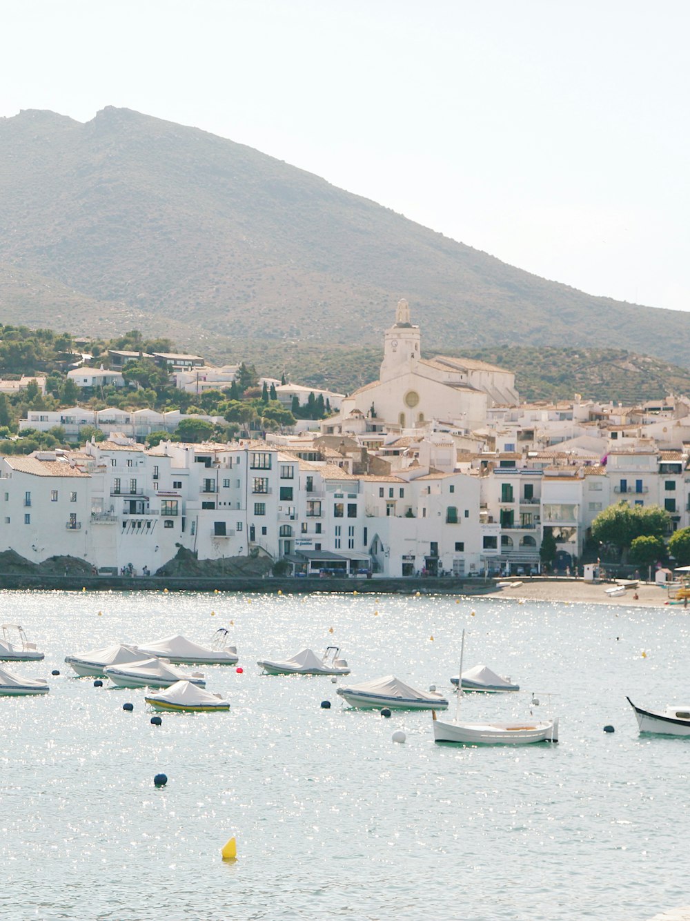 aerial view photography of boats with village background