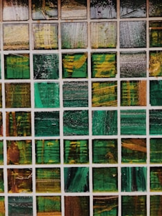green, white, and brown abstract painting
