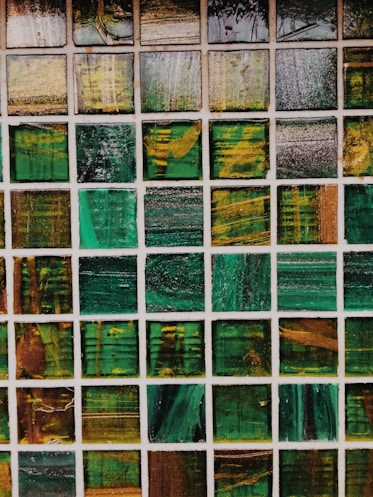 green, white, and brown abstract painting