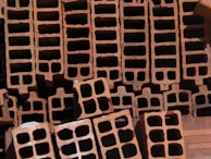 A close-up of fly ash bricks highlighting their fine grain and solid structure.