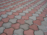 Detailed view of eco-friendly pavers made from recycled materials laid out in a pattern