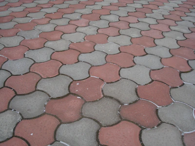 Detailed view of eco-friendly pavers made from recycled materials laid out in a pattern