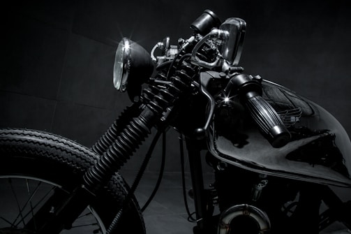 Close-up of a content creator capturing detailed shots of a custom motorcycle.