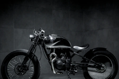 A craftsman carefully assembling a sleek, modern sidecar in a minimalist workshop.