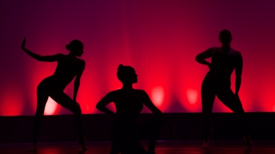 silhouette of people dancing