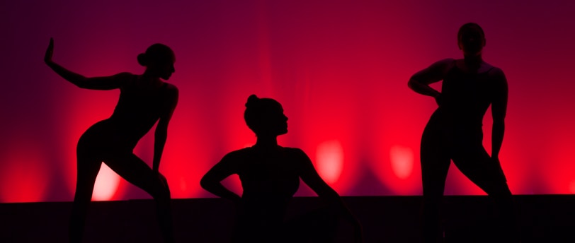 silhouette of people dancing