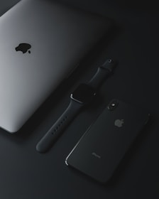 An elegant display of Apple products including iPhones and MacBooks with rounded edges.