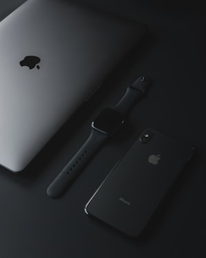 An elegant arrangement of tech gadgets on a sleek surface.