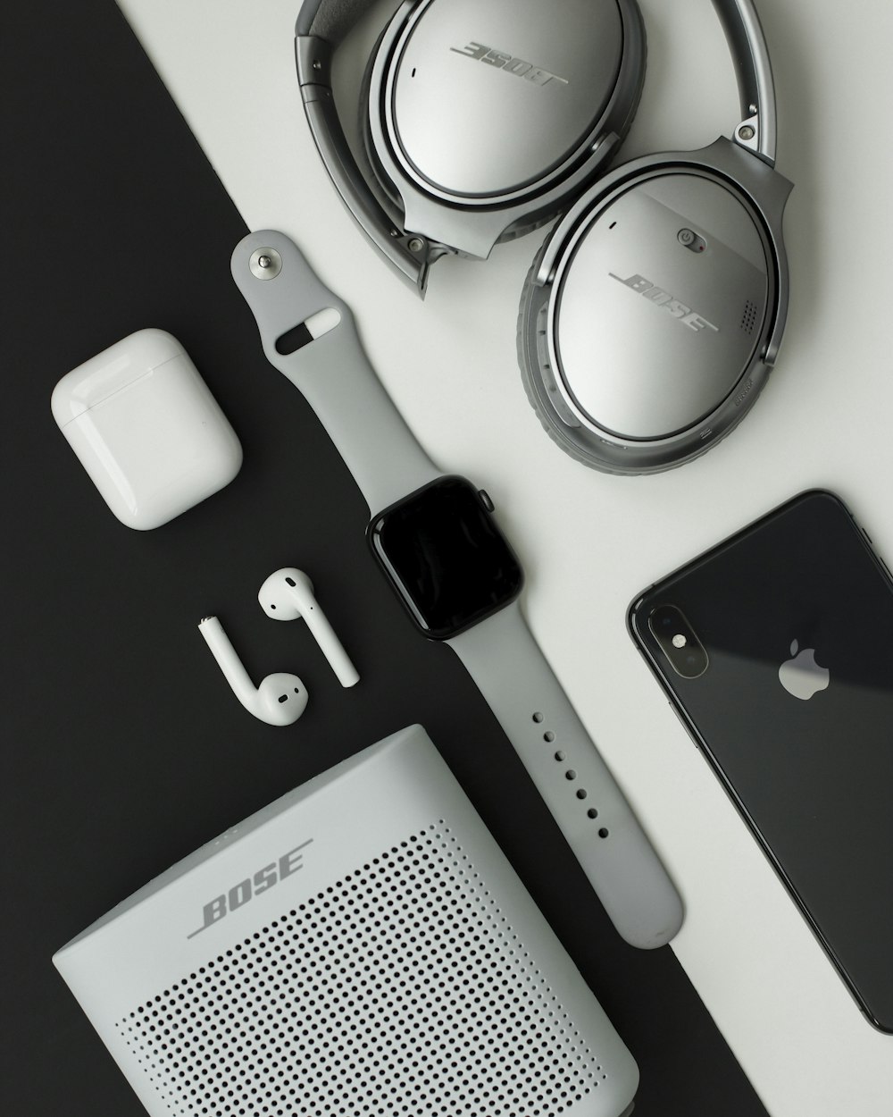 Gray Bose headphones, Apple Watch and iPhone on white and black surface  photo – Free Grey Image on Unsplash