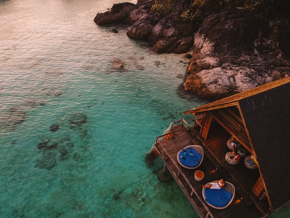 brown house on body of water