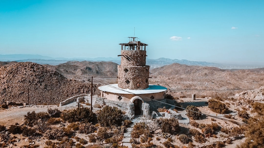 brown concrete building in the mountain