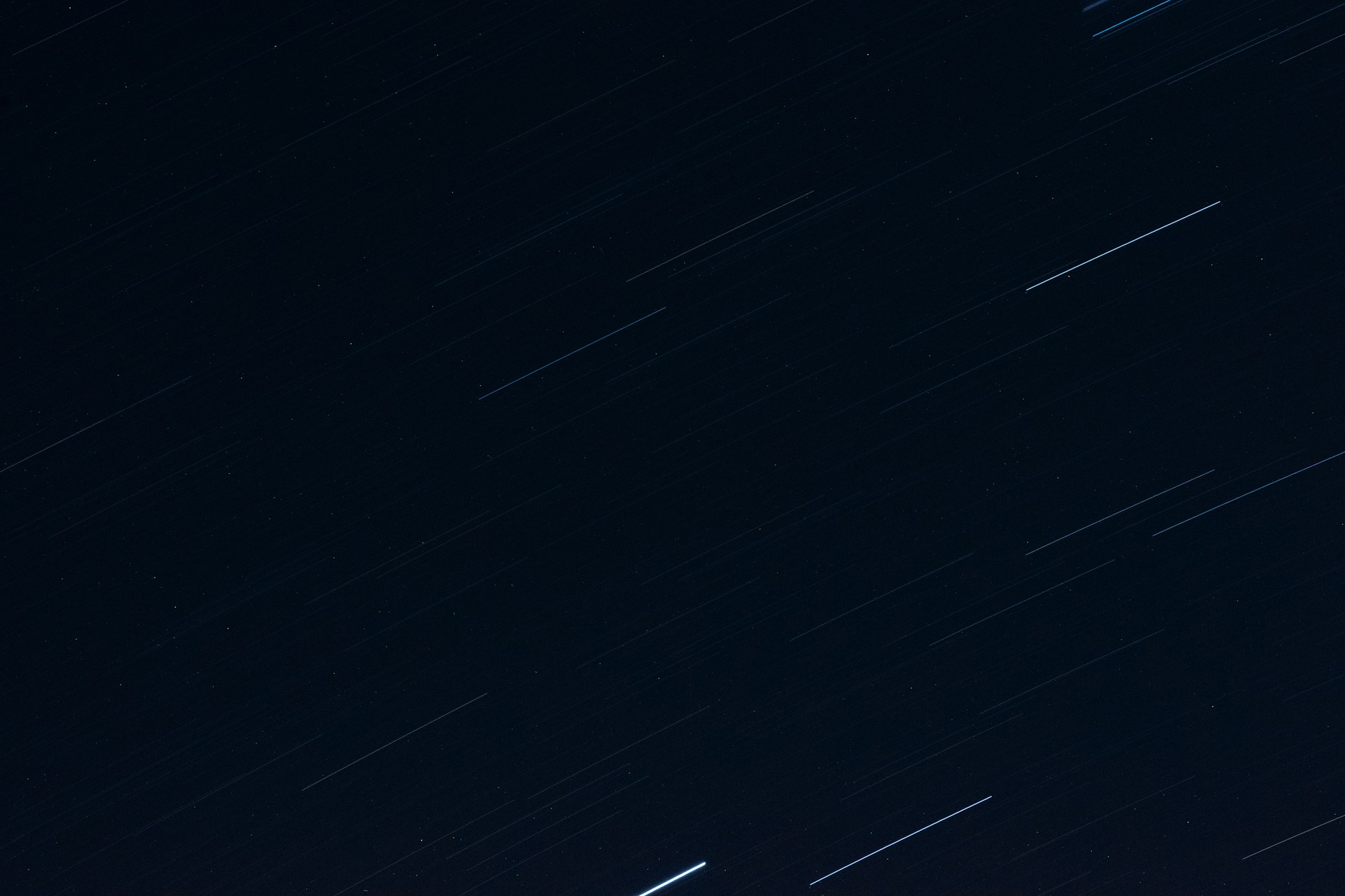 a night sky with stars and a line of stars in the sky