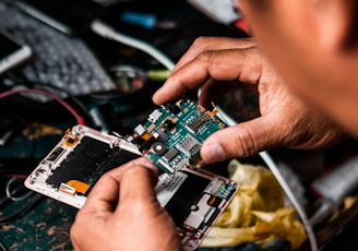 man repairing Android smartphone