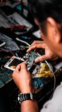 man repairing Android smartphone