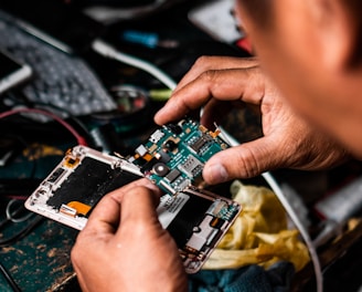 man repairing Android smartphone