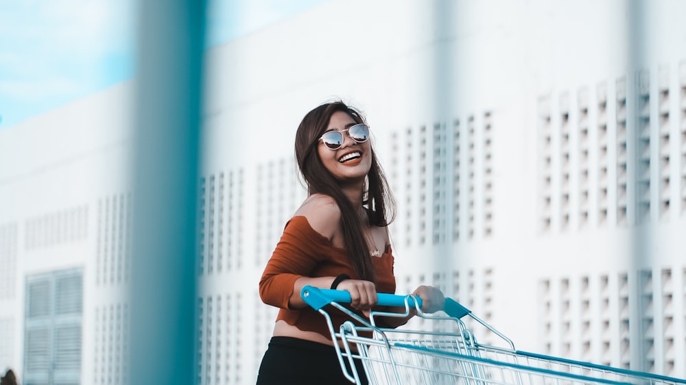 woman holding shopping cart