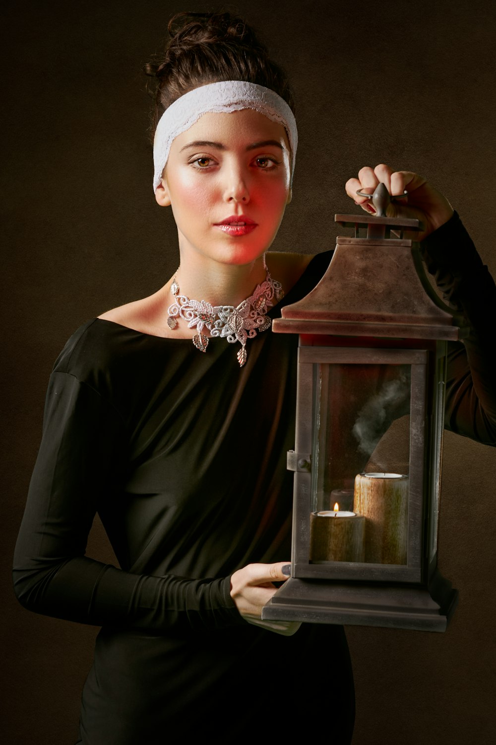 woman holding lantern lamp painting