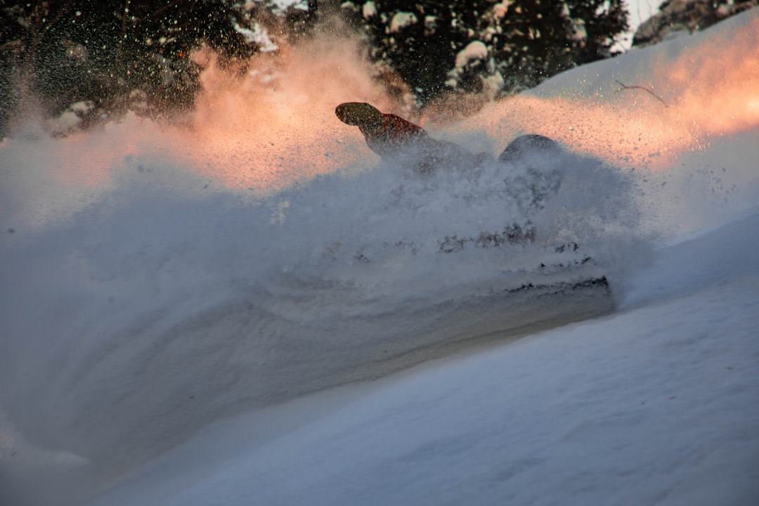 person sliding on snow