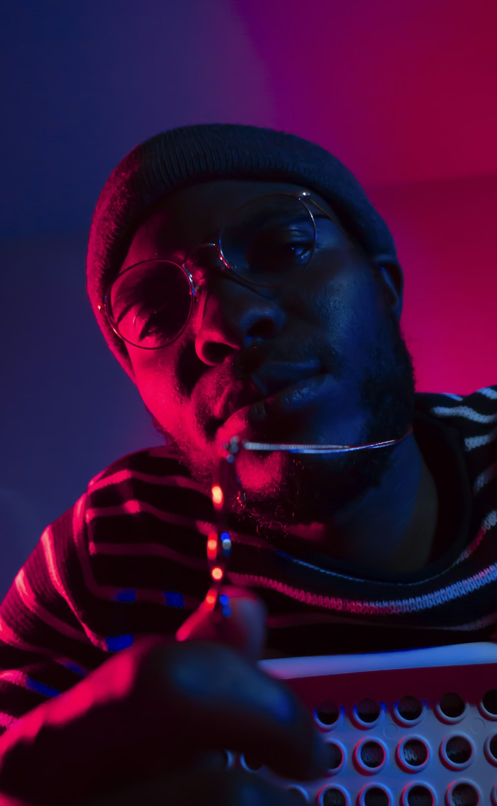 man wearing sunglasses showing necklace