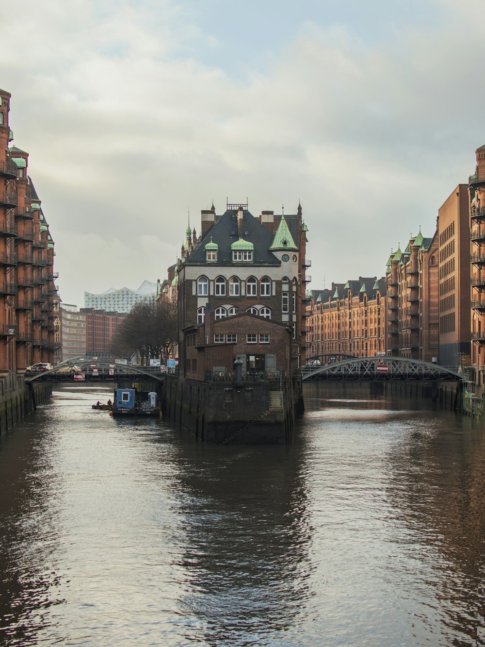 concrete buildings near body of water