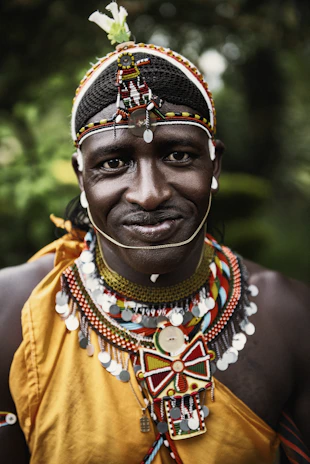 selective focus photography smiling man wearing multicolored costume