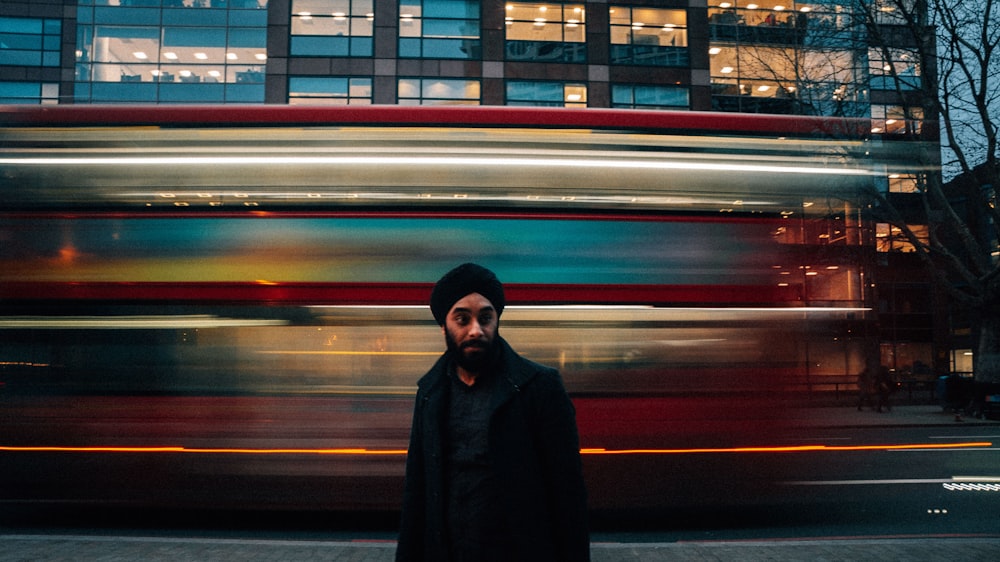 man wearing black jacket time-lapse photography