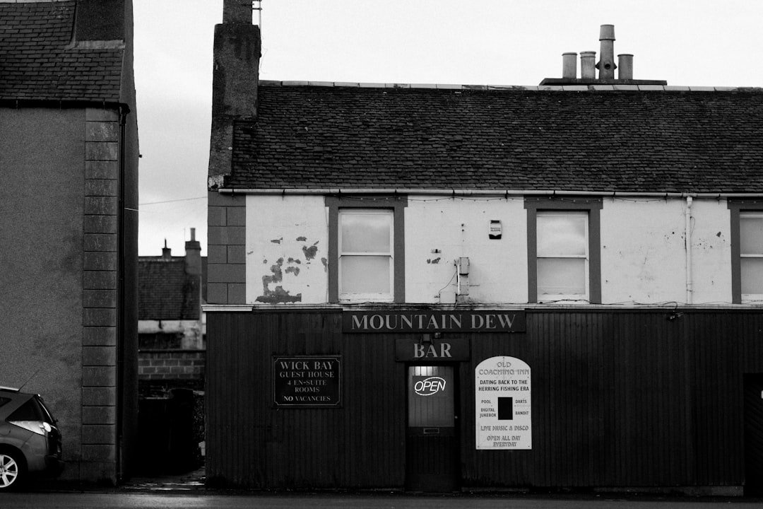 grayscale photo of mountain dew bar
